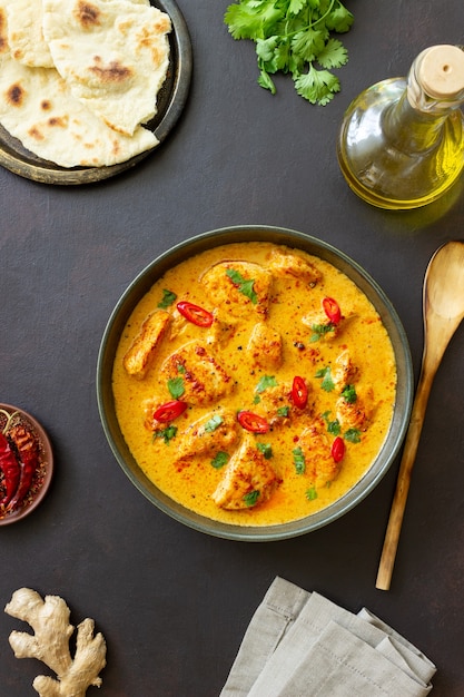 Chicken tikka masala curry with herbs and peppers. Indian food. National cuisine.