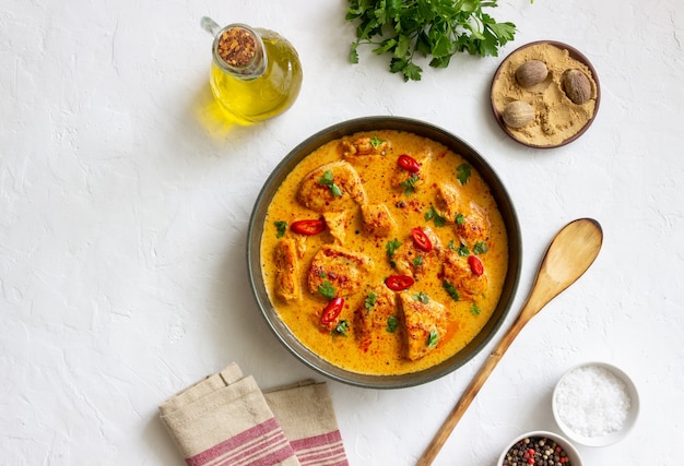 Chicken tikka masala curry with herbs and peppers. Indian food. National cuisine.