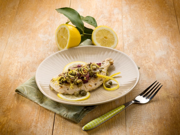 Chicken with capers onions and lemon peel