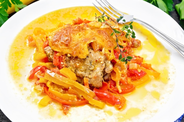 Chicken with pepper in white plate on napkin