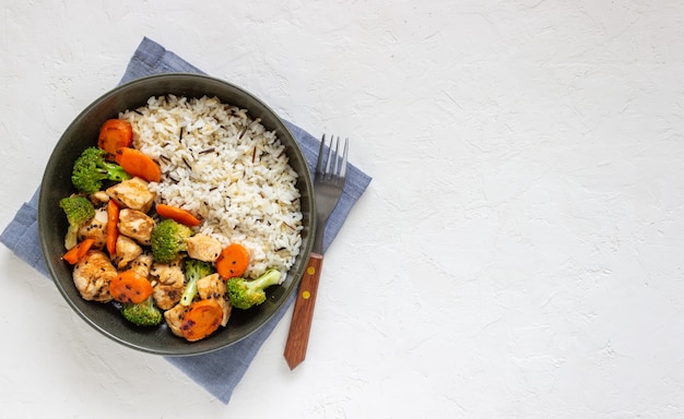 Chicken with rice, broccoli, carrots and soy sauce. Healthy eating. Diet. Recipe.