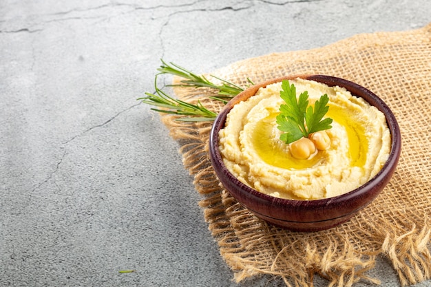 Chickpeas hummus with olive oil in the bowl