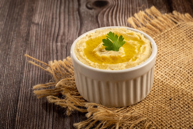 Chickpeas hummus with olive oil in the bowl