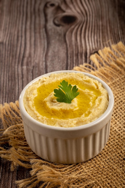 Chickpeas hummus with olive oil in the bowl