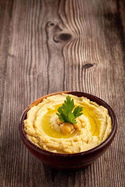 Chickpeas hummus with olive oil in the bowl