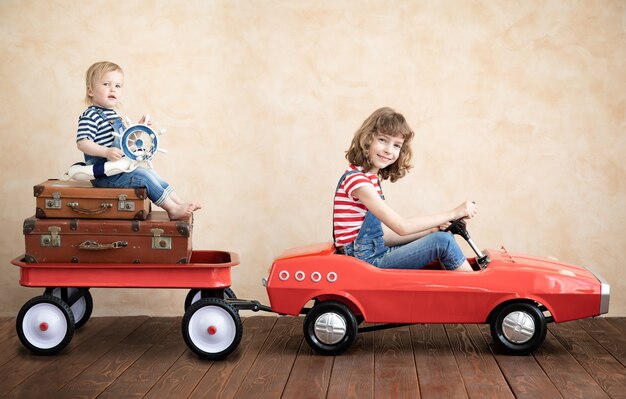 Child and baby playing at home. Summer vacation and travel concept