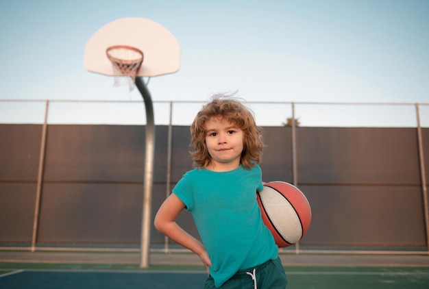 Child boy preparing for basketball shooting young kid posing with a basket ball basketball kids scho