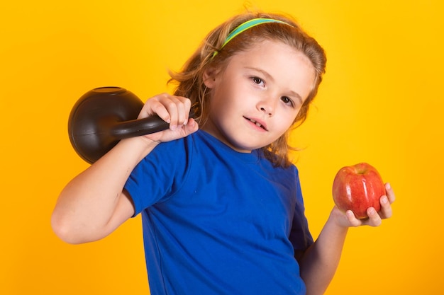 Child boy working out with dumbbells Kids sport and active healthy life Sport and kids training