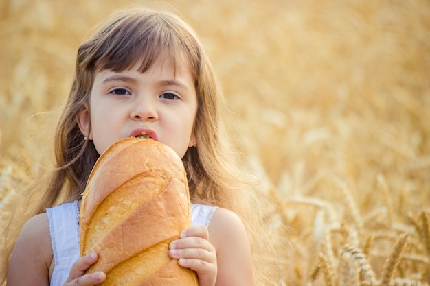 Child and bread selective focus food and drink