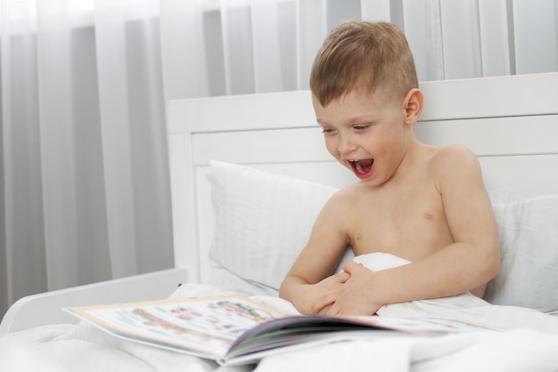 The child broke into a smile as he read the incredible story in the book