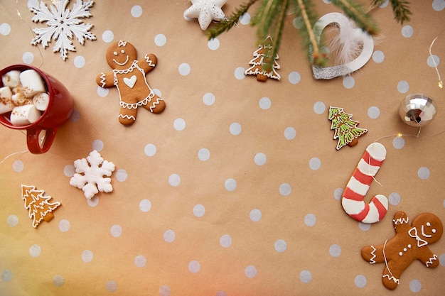 Child and Christmas homemade cookies hot beverage with marshmallow festive Christmas decorations Aesthetic Christmas atmosphere home coziness and warmth concept Festive Christmas tsble setting