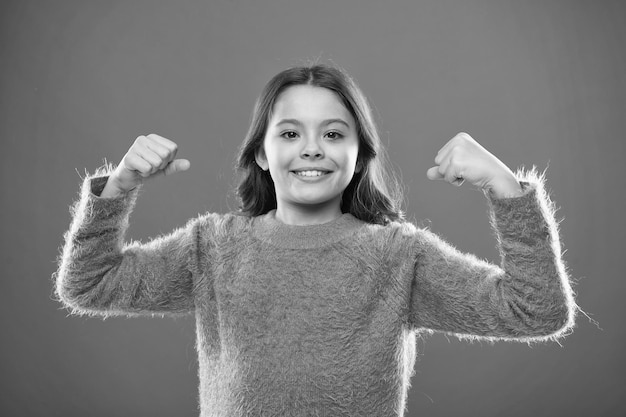 Photo child cute girl show biceps gesture of power and strength feel so powerful girls rules concept upbringing advices for girls strong and powerful golden rules for raising mentally strong kids