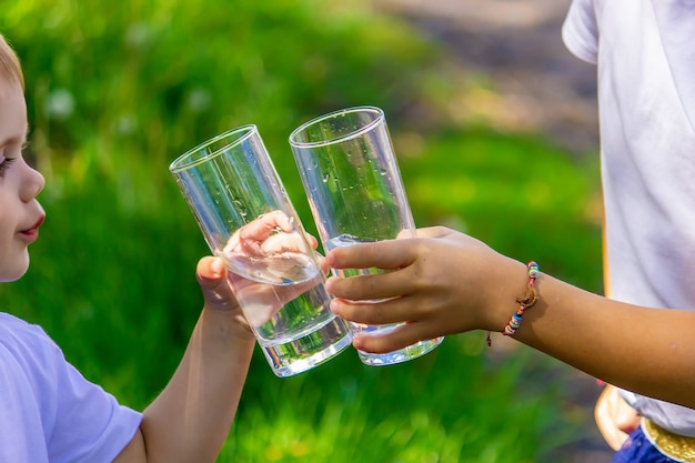 The child drinks clean water in summer