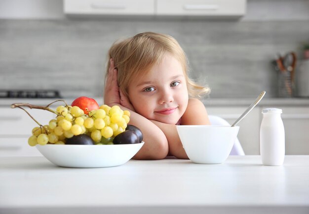 Child eating fruits,kid have a lunch. Little girl healthy nutrition concept