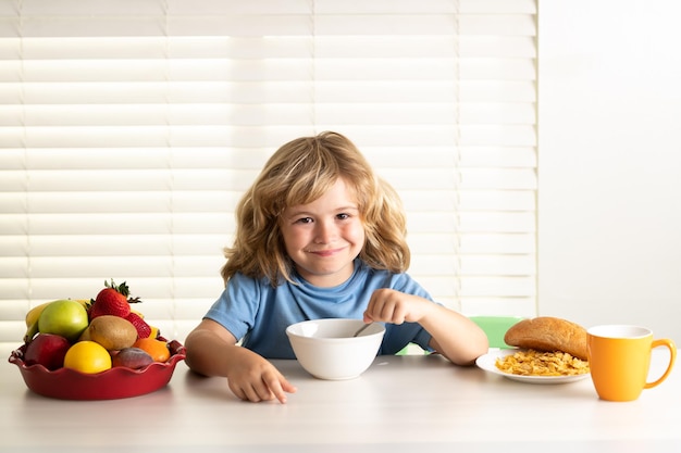 Child eating meal healthy nutrition for children cute boy enjoy eating for morning breakfast with ap