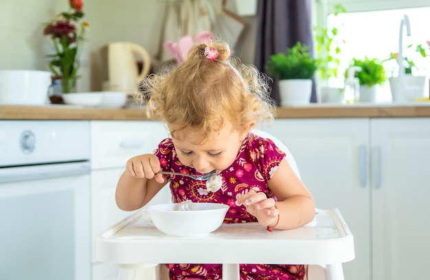 The child eats dumplings at the table Selective focus