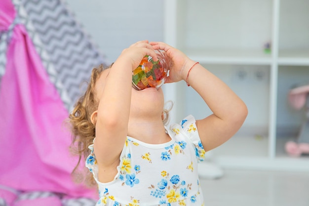 The child eats jelly candies Selective focus