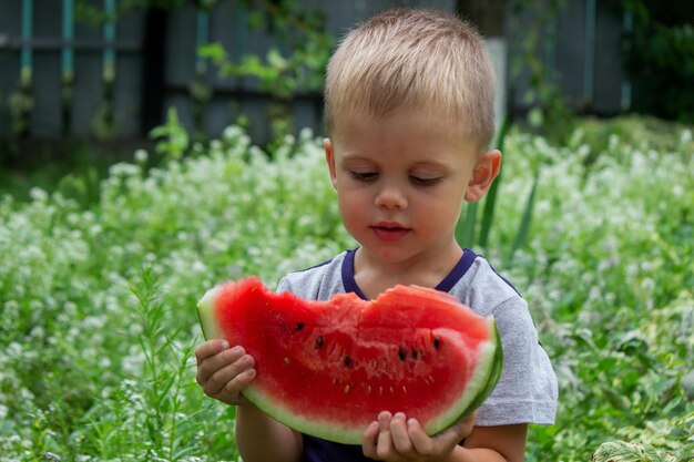 A child eats watermelon Selective focus