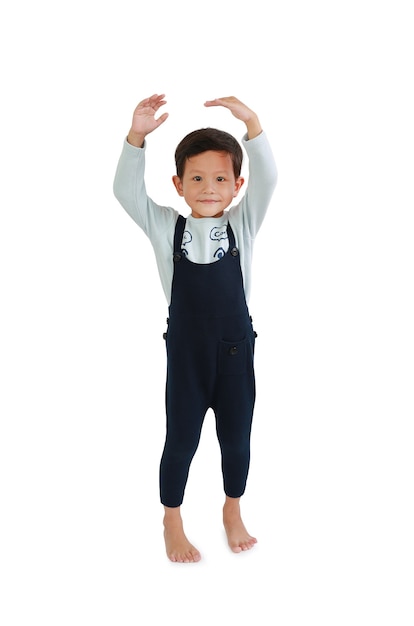 Child estimate his height by hands with looking camera. Asian little boy measures the growth isolated on white background