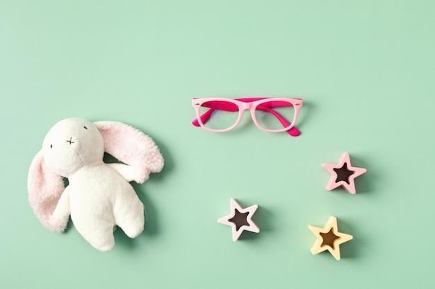 Child eyeglasses over pastel background Optical store glasses selection for kids