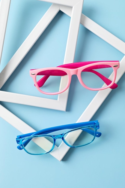 Child eyeglasses over pastel background Optical store glasses selection for kids