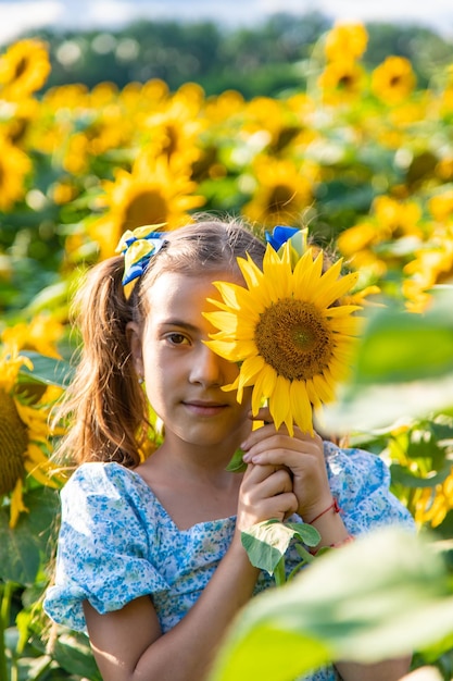 A child in a field of sunflowers Ukraine Selective focus