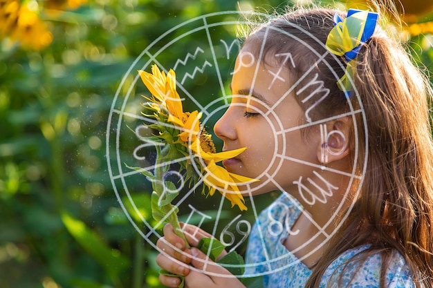 A child in a field of sunflowers Ukraine zodiac sign Selective focus