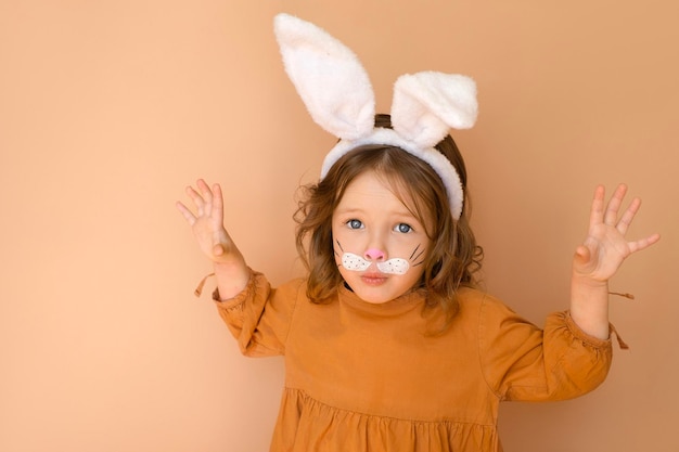 A child in the form of rabbit with headdress with white ears