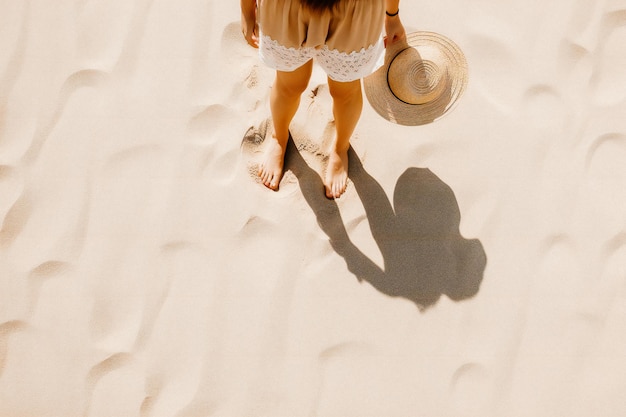 Child girl on the beach with a hat ai generated