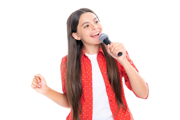 Child girl holding wireless microphone for karaoke singing or talk and speaker on white background