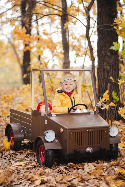 A child girl walks in the autumn park