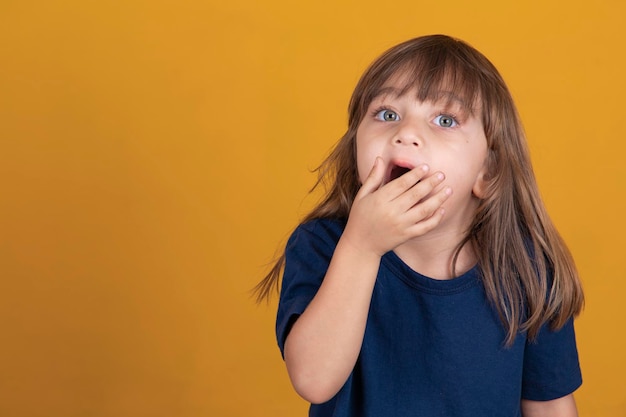 Child girl yawning with mouth open