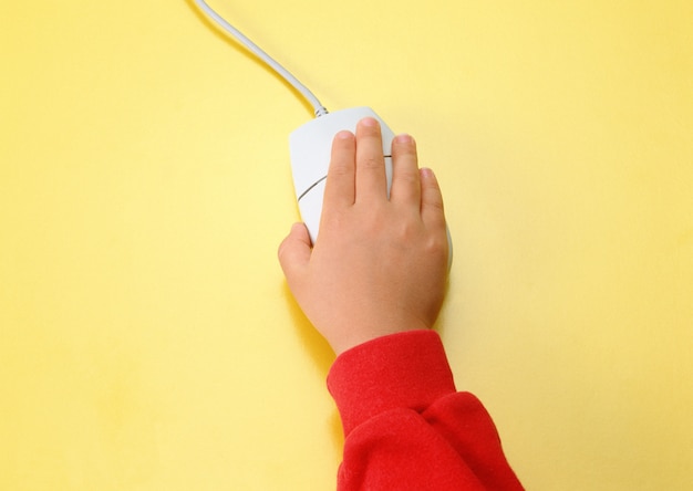 child hand holding pc mouse