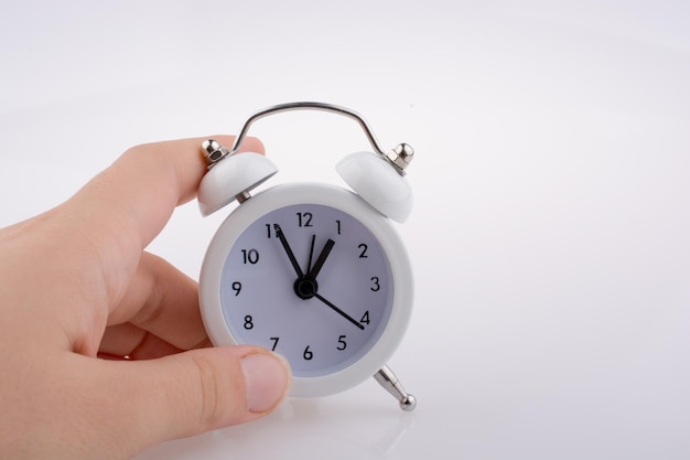 Child holding an alarm clock