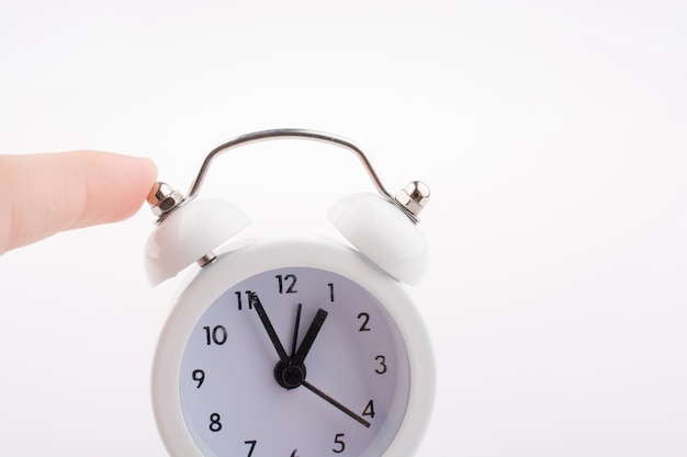 Child holding an alarm clock