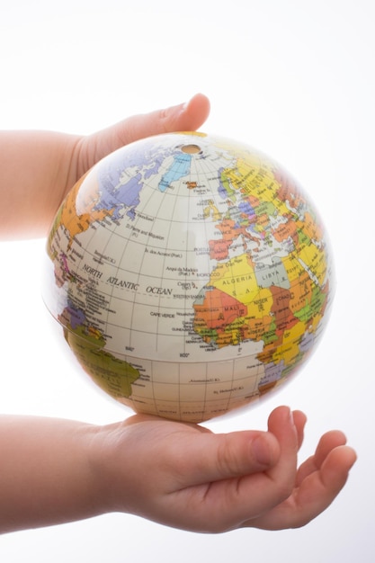 Child holding a globe in his hand