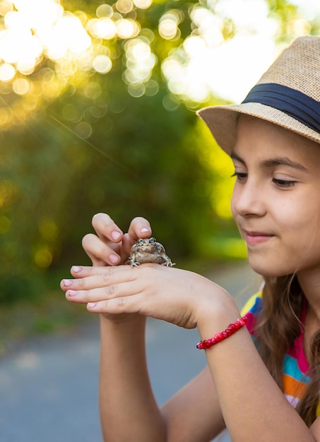 The child is playing with the frog Selective focus