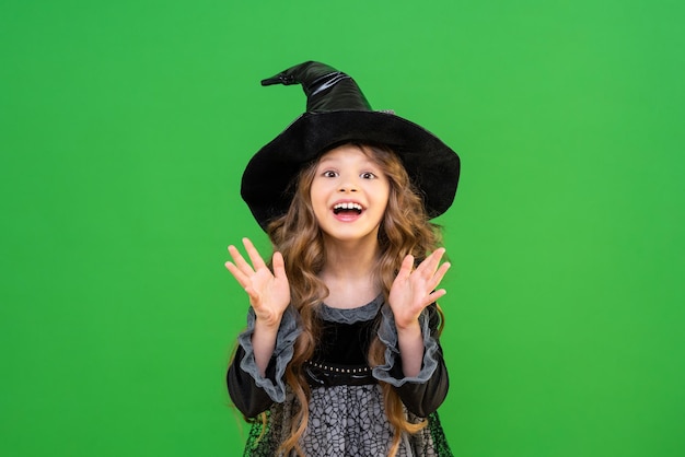 The child is ready for the heluin holiday A girl in a witch's magic hat