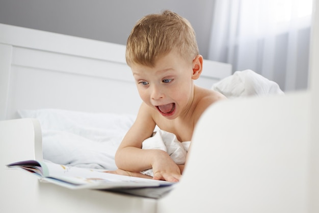 The child is surprised by what he has read in the new book