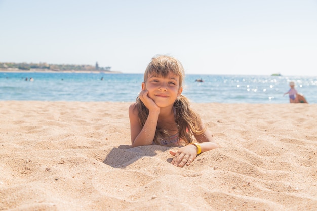 The child is swimming in the sea. Selective focus. Kid.