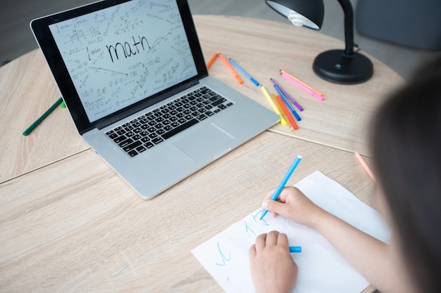 Child Looking at Laptop, Kid with Computer, Little Girl and Notebook, Mathematics Formula, School Education.