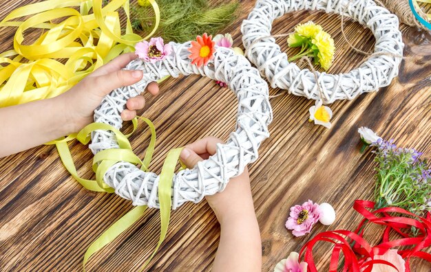 Child making handmade decorations for holliday