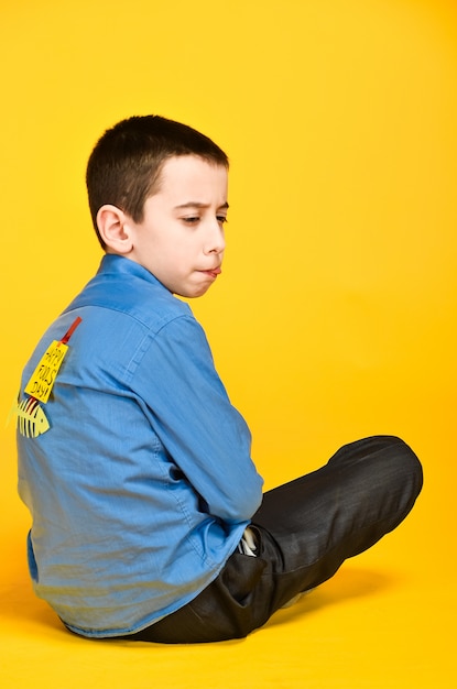 The child meditates engaged in yoga inscription the day of the fool