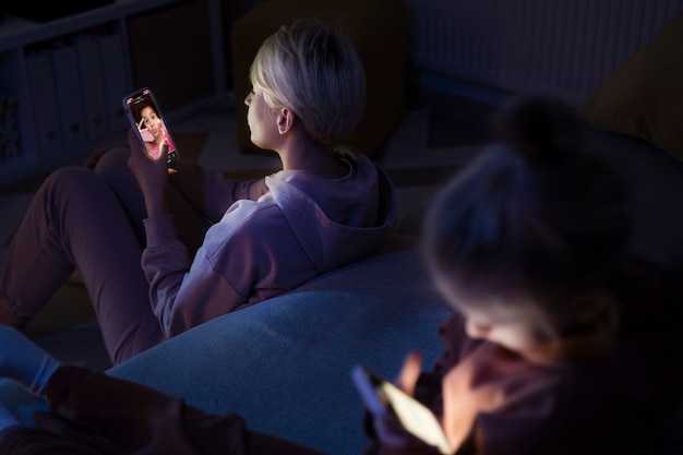 Child and parent suffering from social media addiction