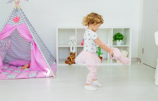 The child plays with toys in the room Selective focus