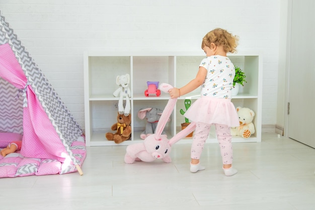 The child plays with toys in the room Selective focus