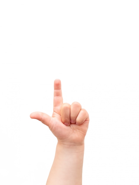 Child's hand. The child points at something with his index finger. Flat lay, top view, copyspace.