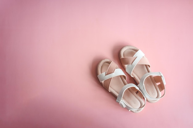 Child's shoes on color background top view flat lay