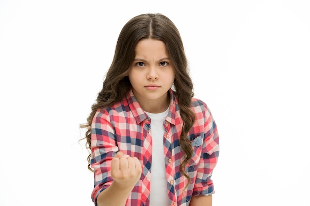 Child show fist gesture isolated on white Little girl with long curly hair feel anger Girls power protection of childrens rights sense of justice My word law Beauty look