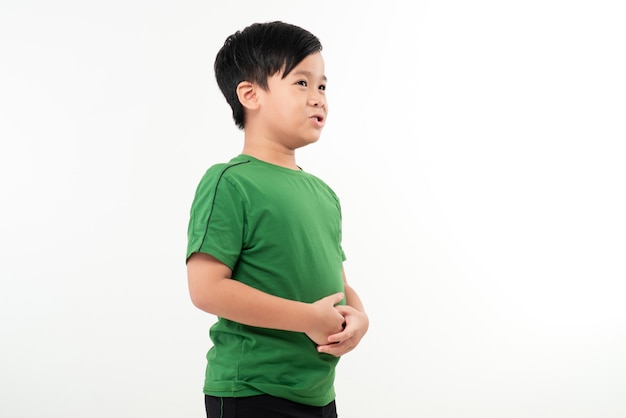 Child standing in profile having a severe stomach ache and screaming isolated on white